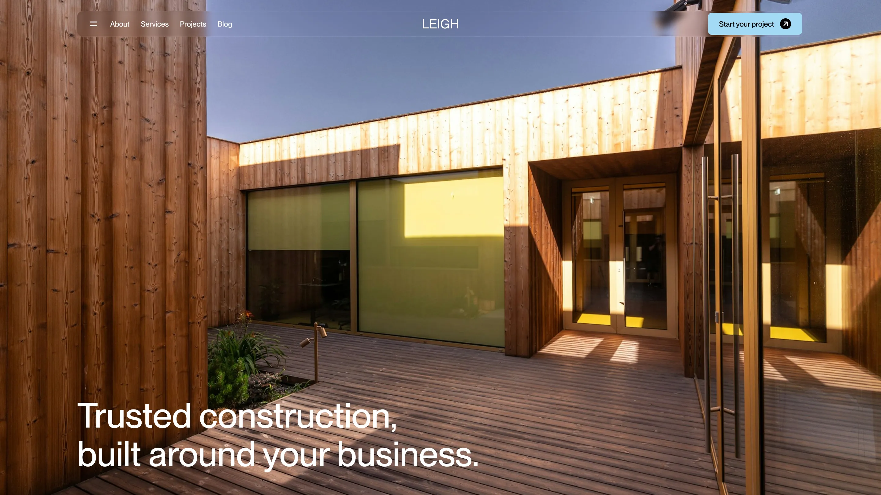 Homepage hero section with full-width construction photography and headline