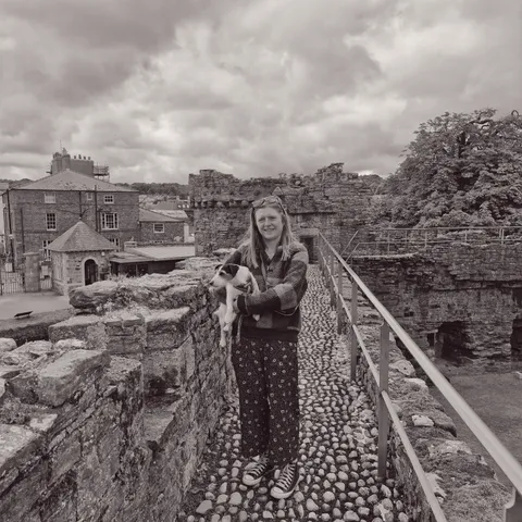 Laura holding Rosie on castle walkway