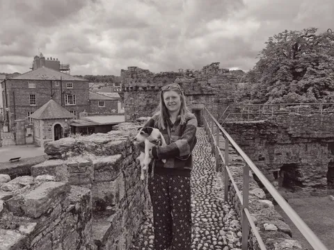Laura holding Rosie on castle walkway