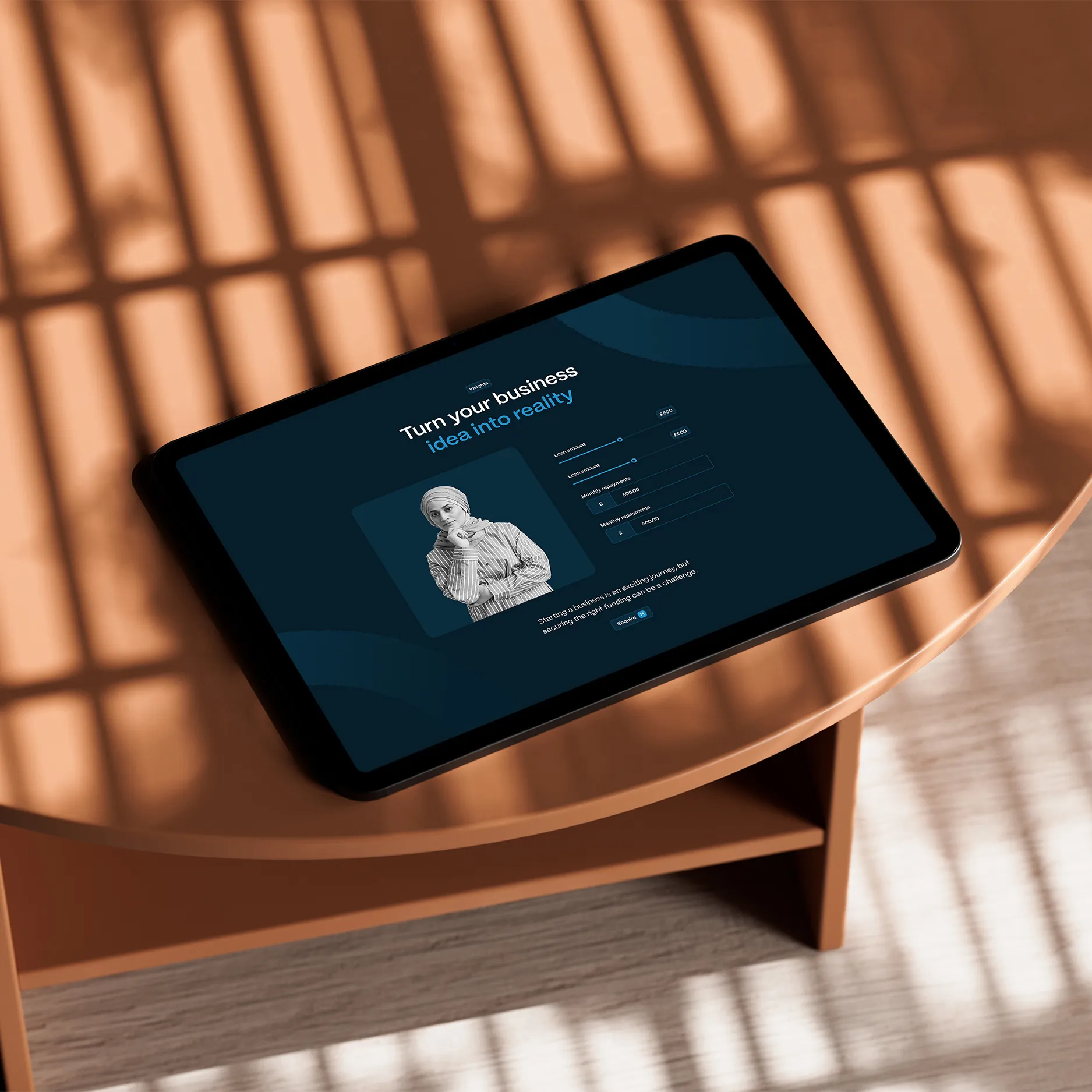 Tablet displaying a dark-themed business startup form with a photo of a woman and the text 'Turn your business idea into reality'