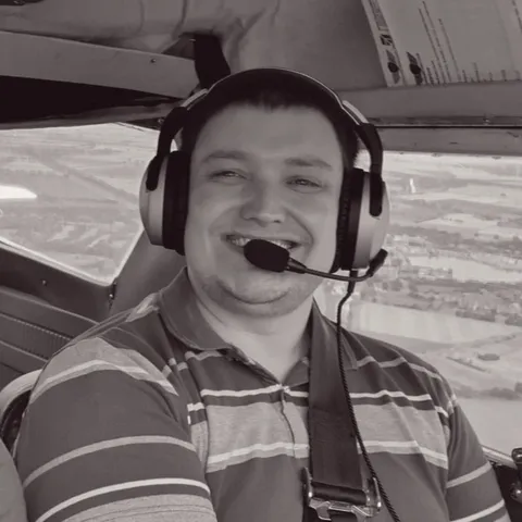 Phill in aircraft cockpit with headset